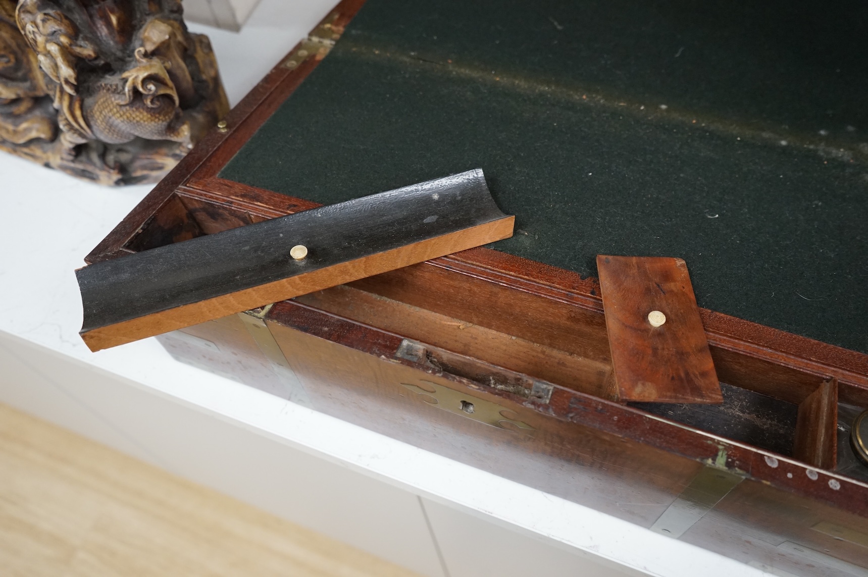An early 19th century brass bound mahogany writing slope with maker's label for J. Allen, 45cm wide